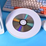 Spinning Retro CD on Blue Tech Surface